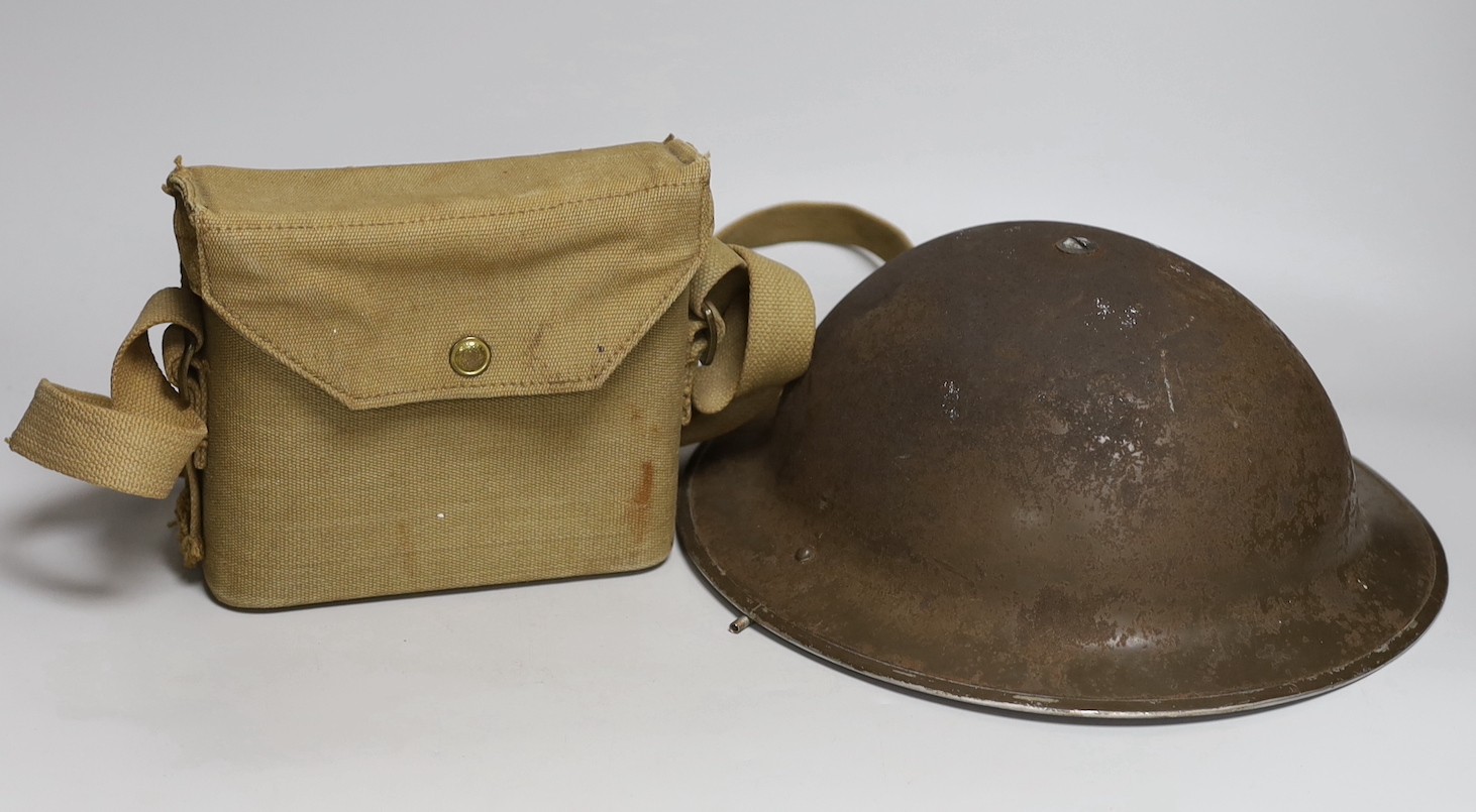 A British WWII military helmet and a pair of Kershaw military binoculars No. 326750